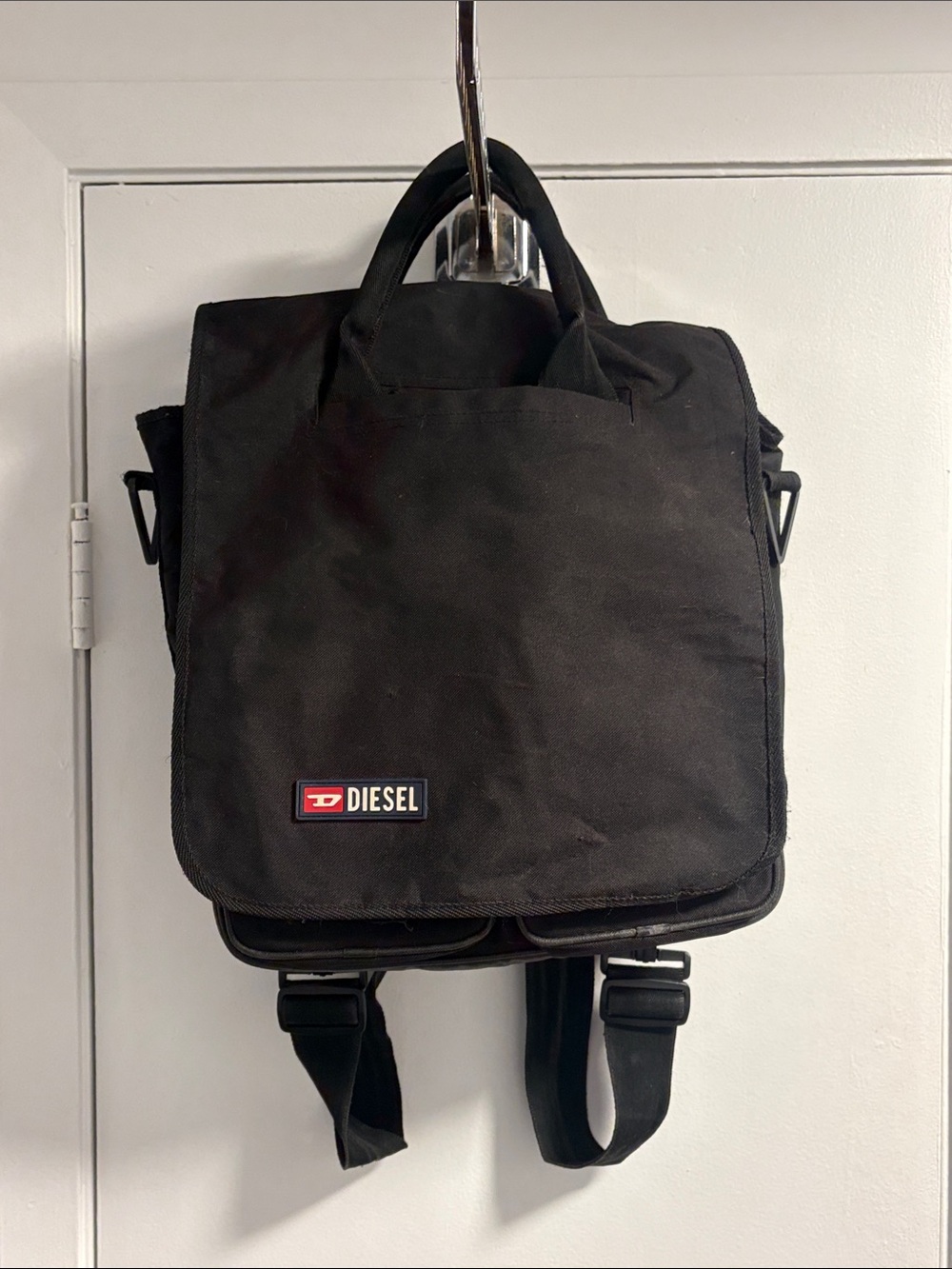 Diesel Vintage Black Canvas Backpack with Red Logo Accent.